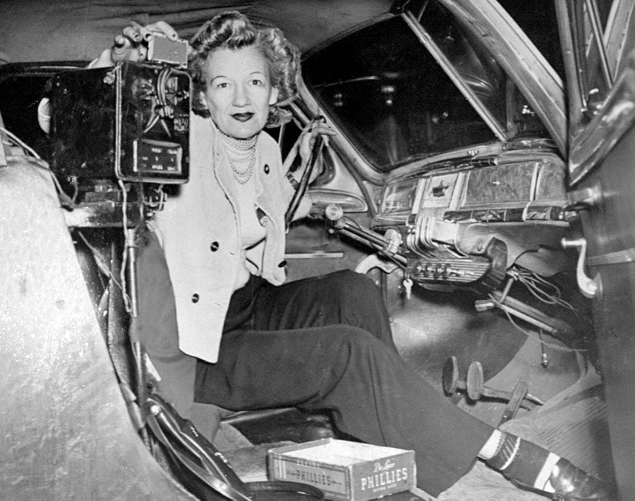 Cab driver Betty Fishbein poses for a photograph in her car.