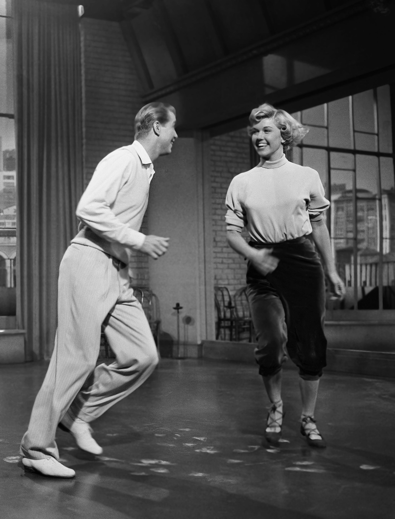 Actress Doris Day rehearses with actor Gene Nelson for a production of 