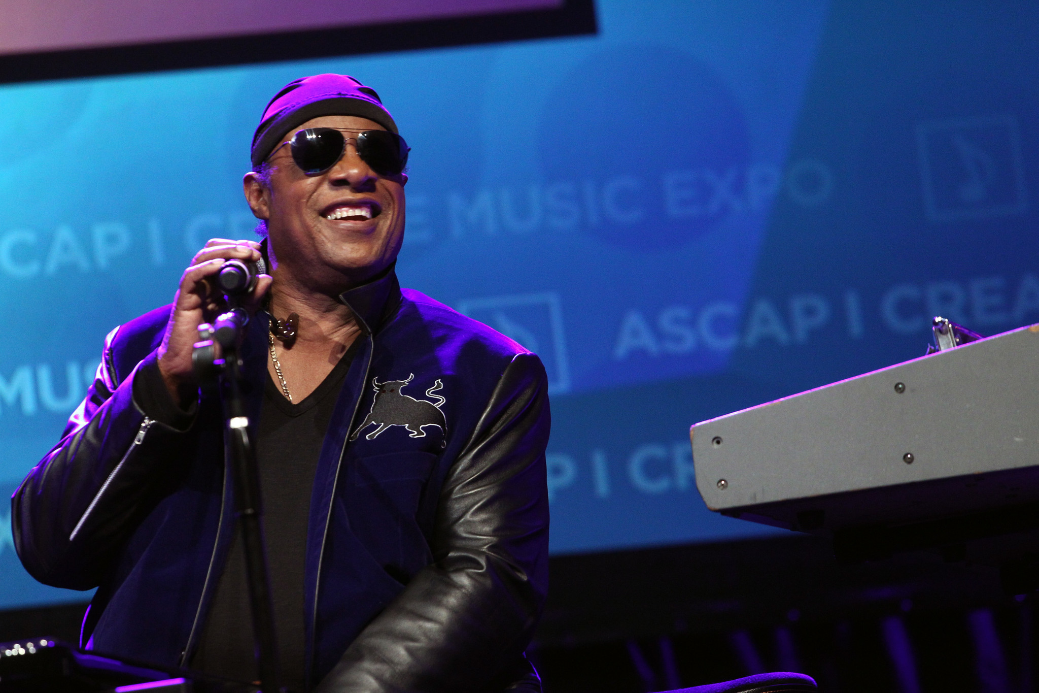 Musician Stevie Wonder is all smiles onstage as he is presented with the 