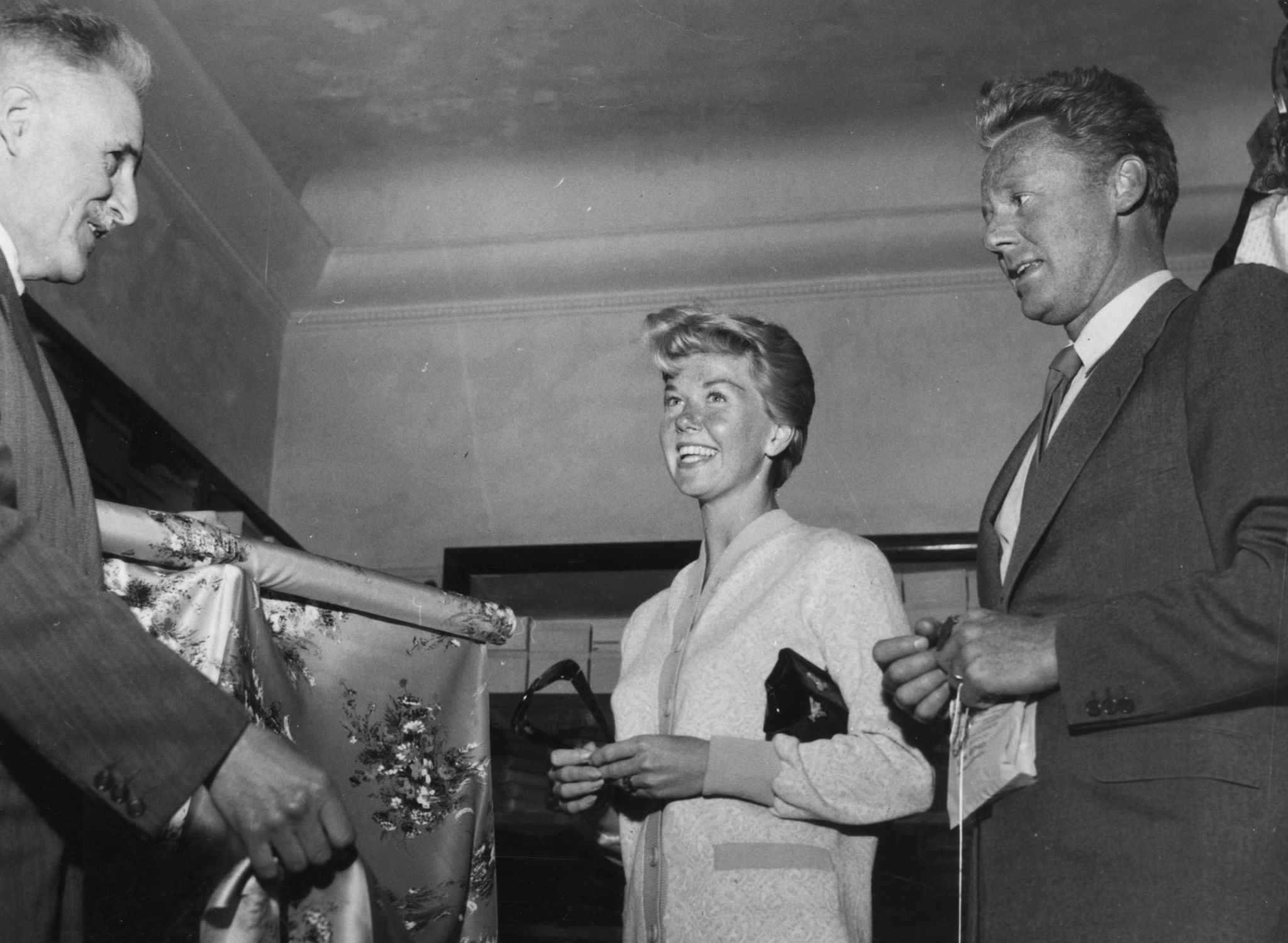 Film actress and singer Doris Day shops with actor Van Johnson, right, on May 3, 1955, in the Italian Riviera resort of San Remo.