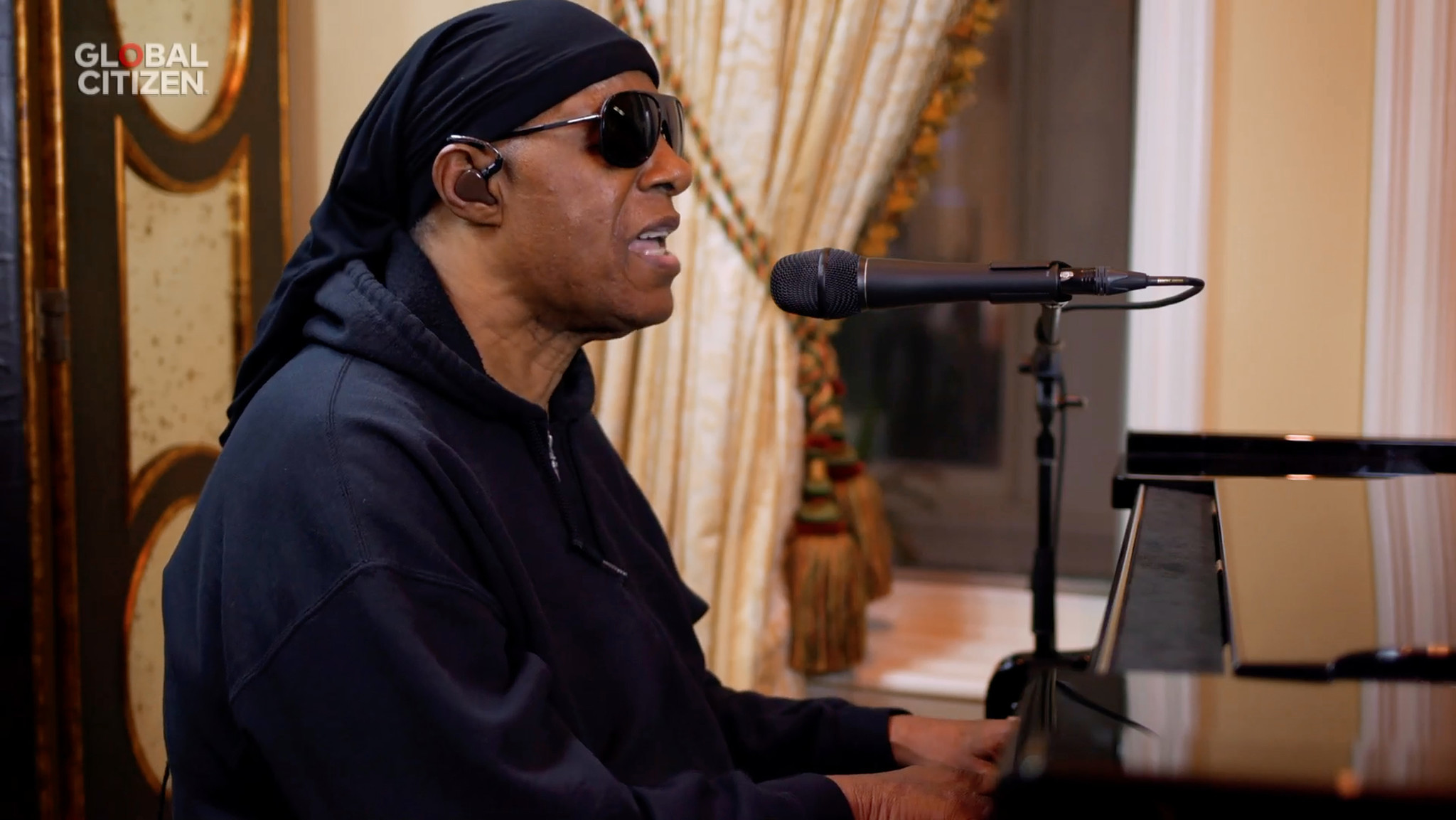 In this screengrab, Stevie Wonder performs during 