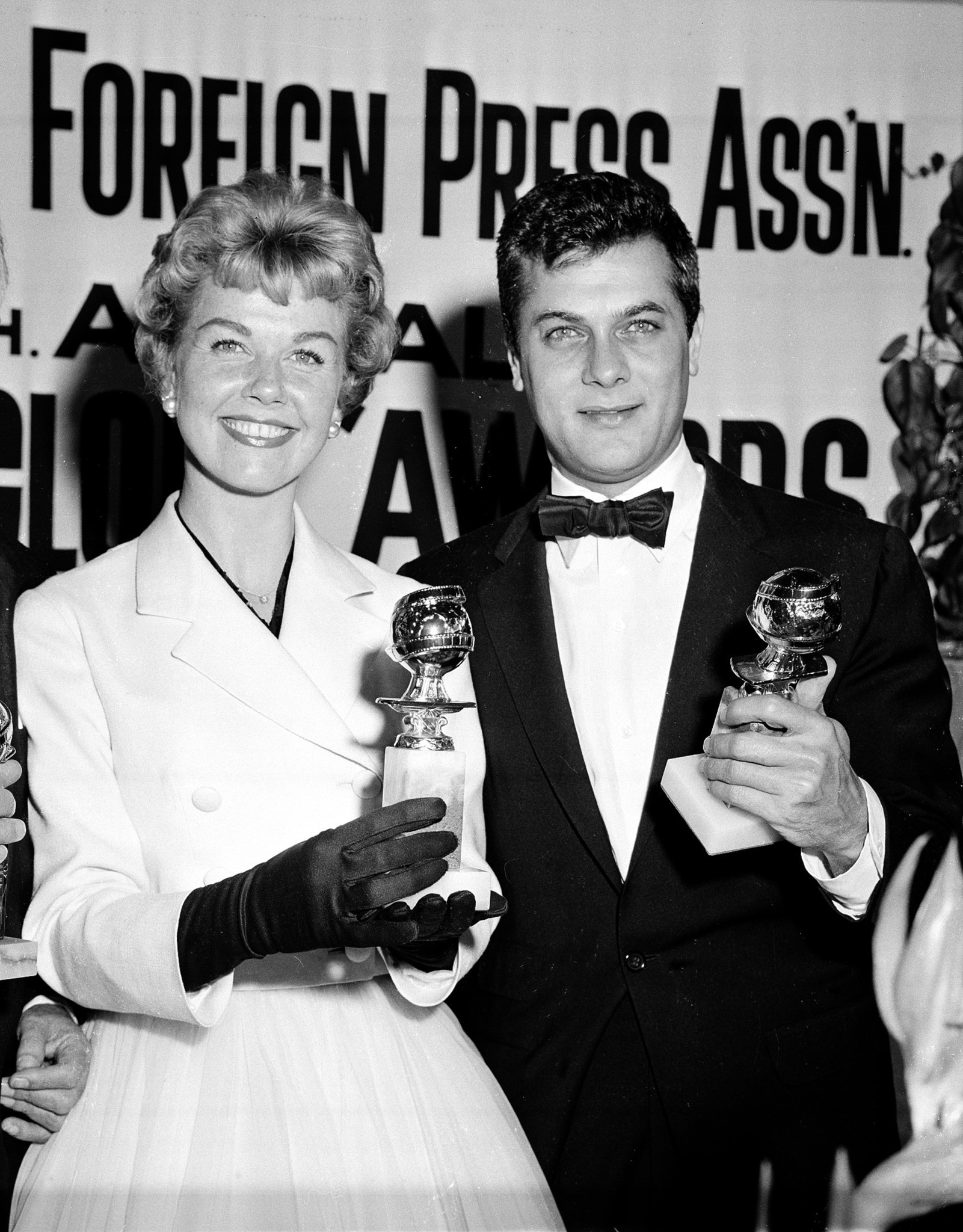 Doris Day and Tony Curtis pose with their Henrietta Awards (World Film Favorites), presented by the Foreign Press Association of Hollywood, on Feb. 26, 1958, at its annual awards dinner in Los Angeles.