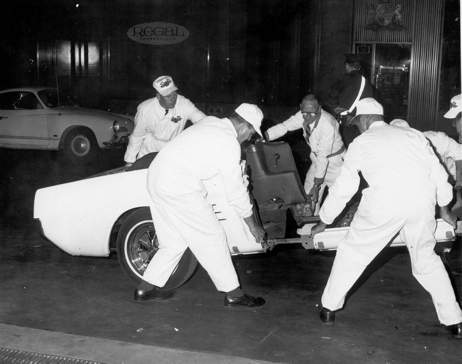 Engineers work with a special Mustang prototype that was cut into pieces for a legendary publicity stunt.