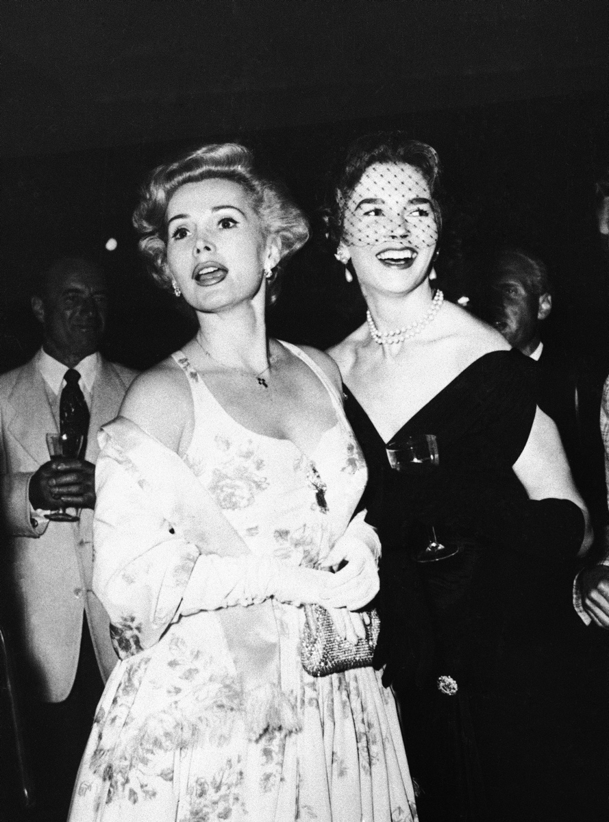 Zsa Zsa Gabor, left, and Dawn Addams, the actress wife of Prince Vittorio Massimo, pictured at the Cannes Film Festival during a party at the Ambassadeurs nightclub on May 7, 1955.