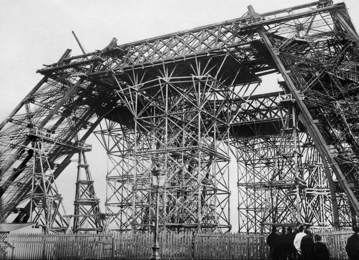 With three floors, the Eiffel Tower stands tall at 986 ft. high. Here, the base of the building is being built in 1888.
