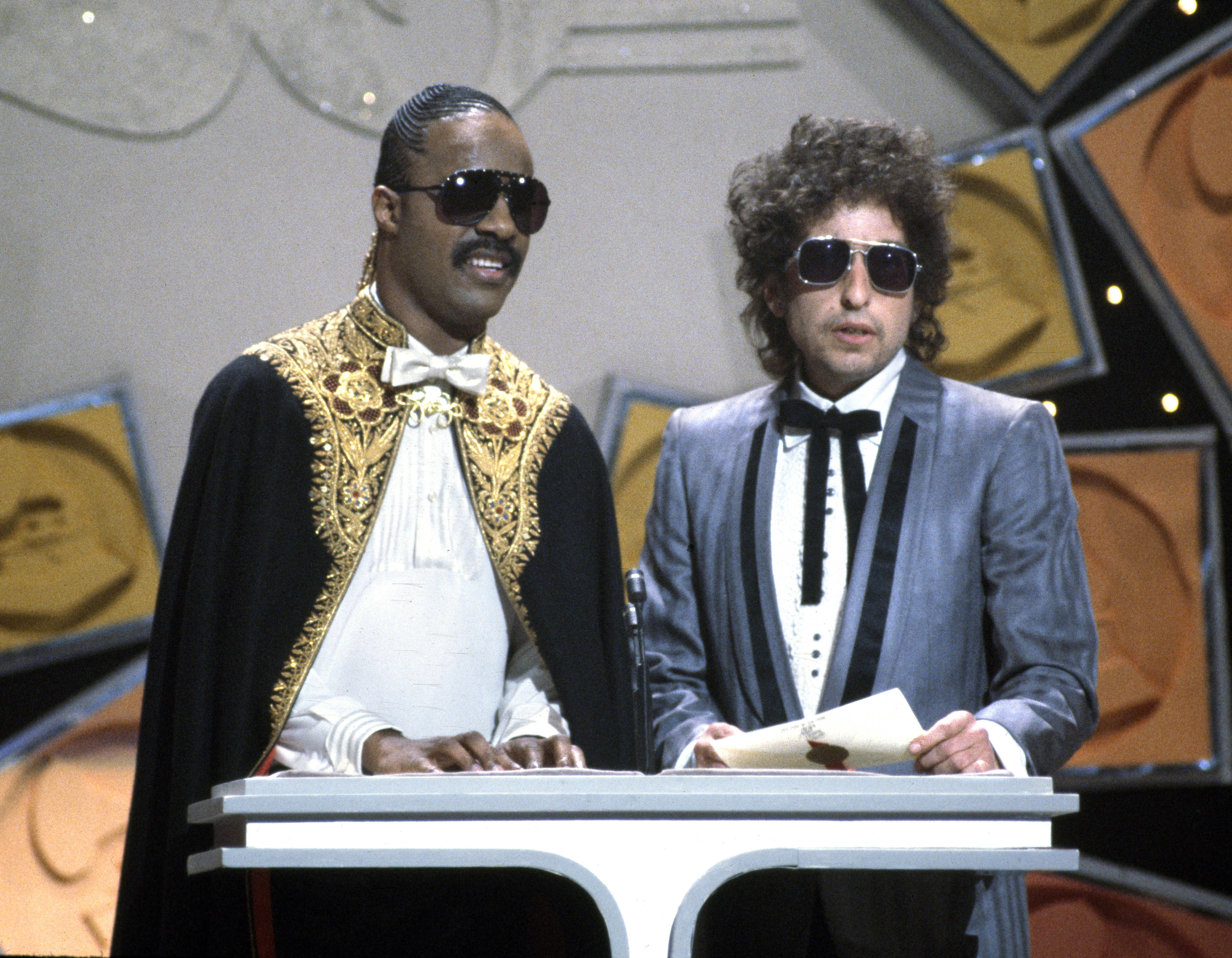 Stevie Wonder, left, and Bob Dylan at the 26th Annual Grammy Awards, presented at Shrine Auditorium, Los Angeles on February 28, 1984.